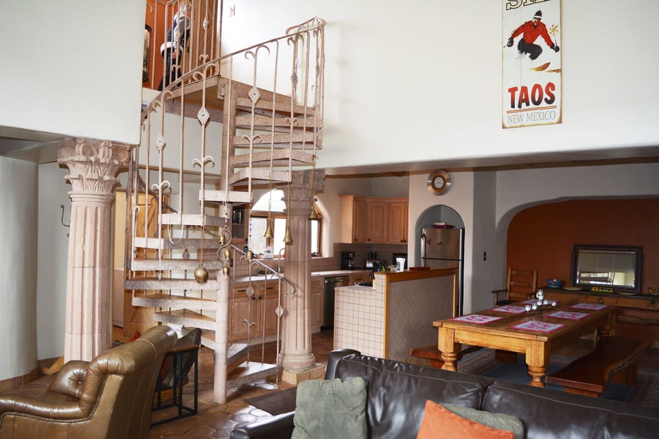 Spiral staircase to private master bedroom