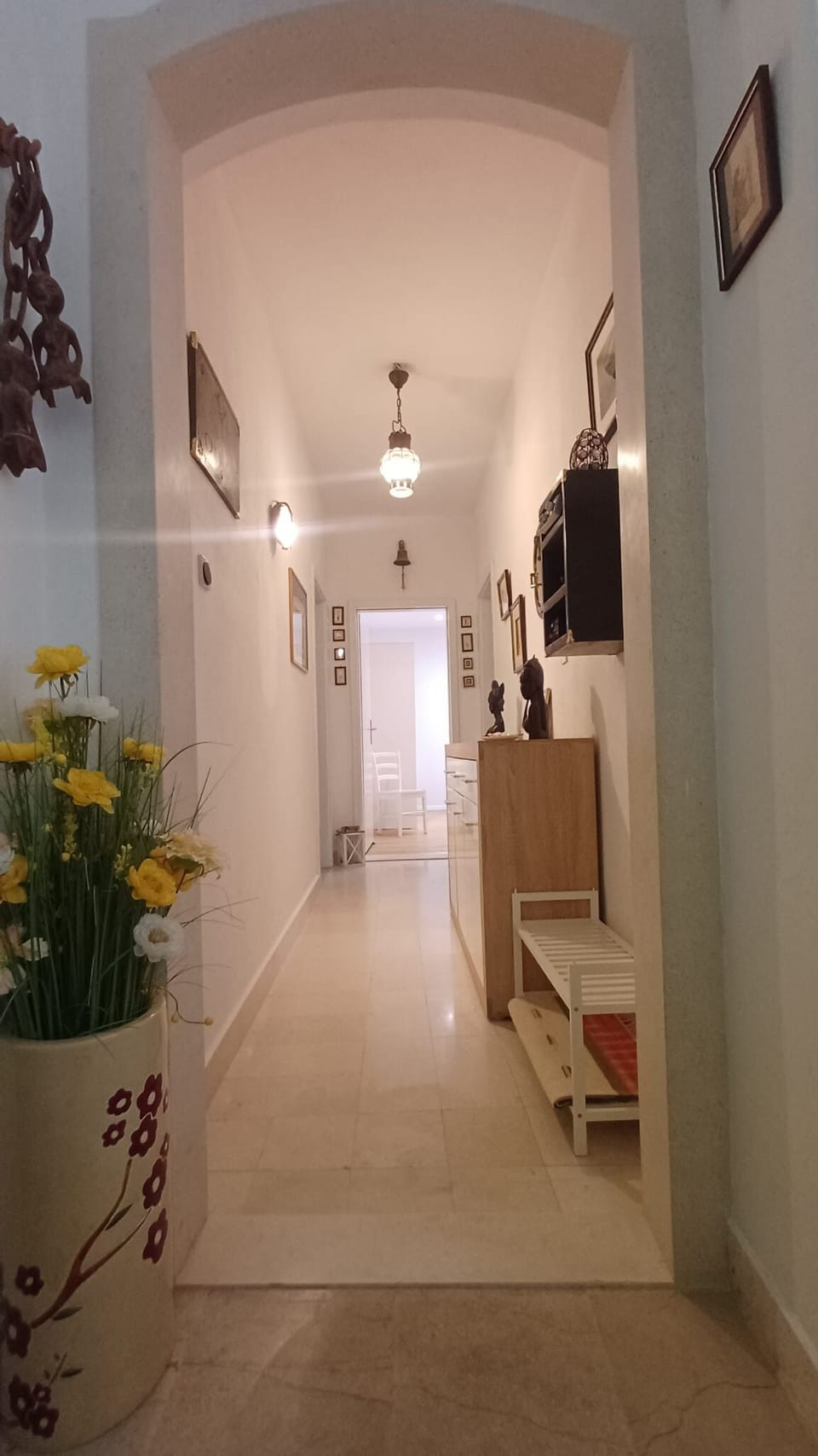 Marble hallway connects 3 bedrooms, family bathroom with kitchen + Living room.