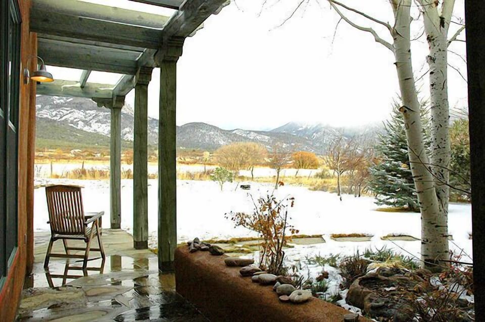 Portal with Taos Mountain and open pasture views