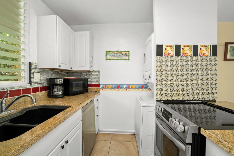 Kitchen is fully equipped with pots, pans and utensils