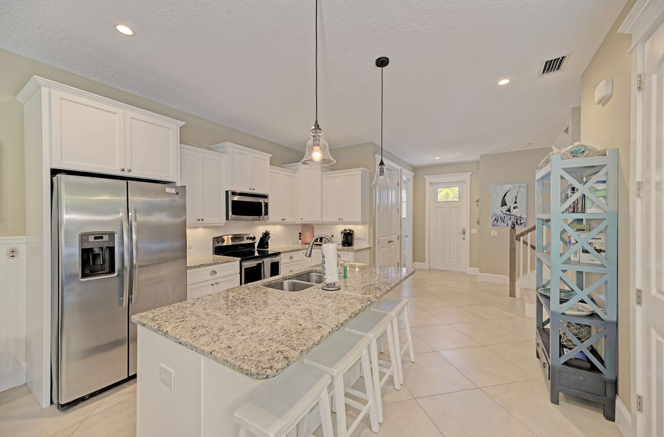Kitchen island has adds additional seating for 4