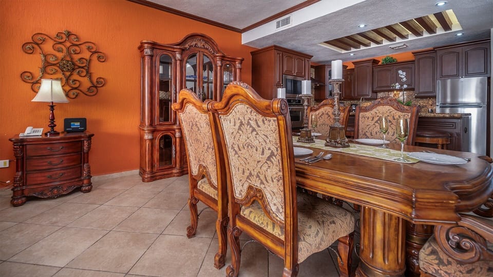 High backed chairs define the dining table.