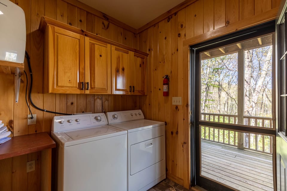 All the comforts of home, tucked into the cabin. A full laundry room with deck access keeps longer stays effortless at Altitude Adjustment.