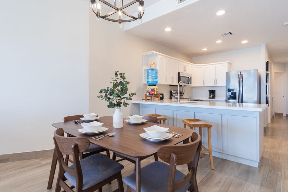 The dining table together with the kitchen.