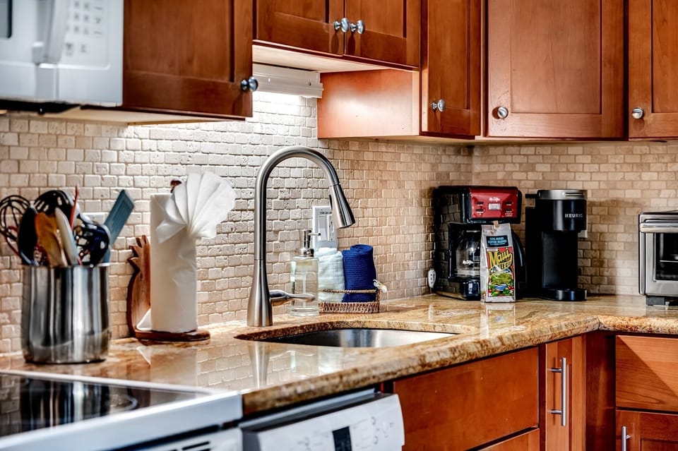 fully equiped kitchen - Get ready for your vacation meal preparation. Full kitchen with Mr. Coffee, Keurig, rice cooker and blender not shown. All the utensils needed and plenty of pots and pans.