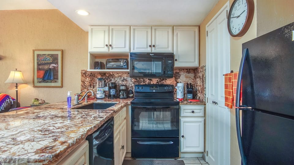 The kitchen has complete appliances.