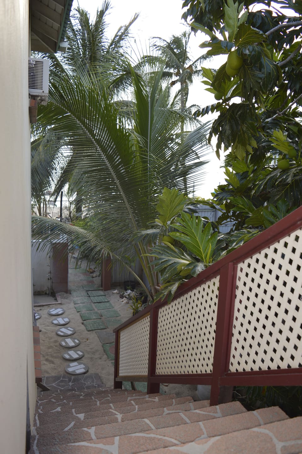 Access from apartment to the garden and beach.