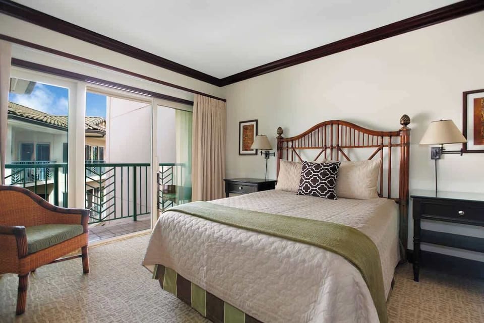 Master bedroom with king bed, premium bedding, and flat-screen TV