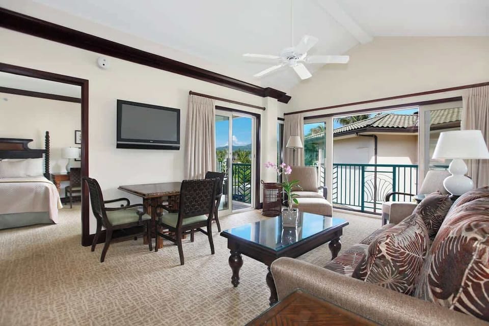 Open-concept living room with island views and modern furnishings