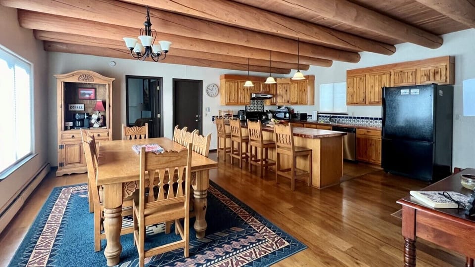 Large country kitchen, copper counters, large dining table + breakfast bar