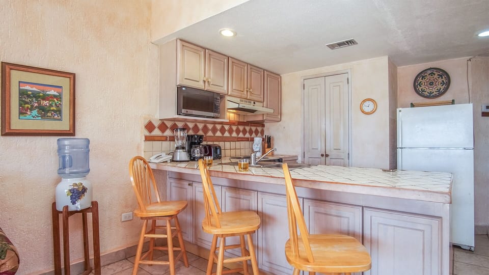 Bar stools at the kitchen counter.