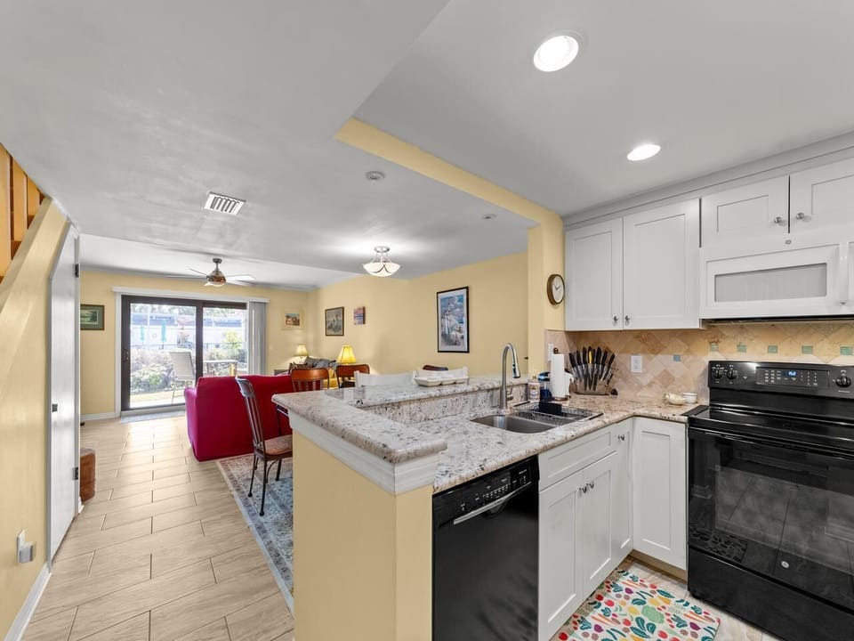 Bright open kitchen and living area with cozy dining space