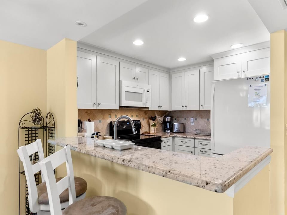 Bright, modern kitchen with spacious granite countertops