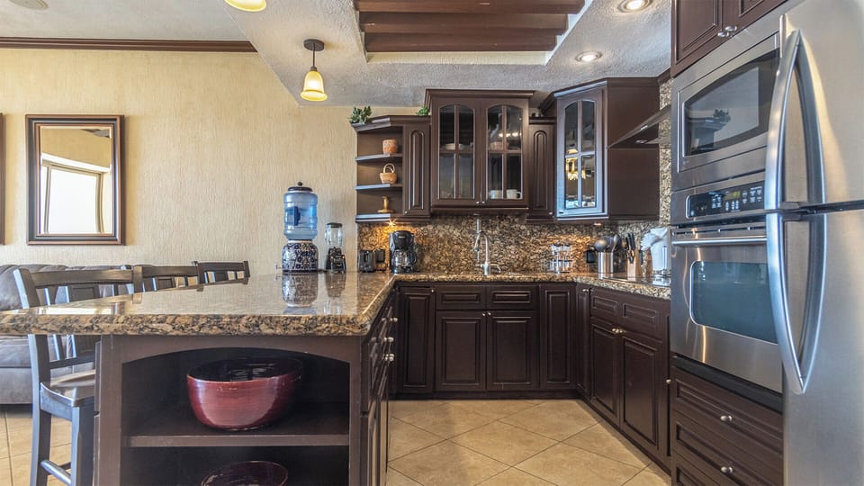The kitchen is complete and elegant.