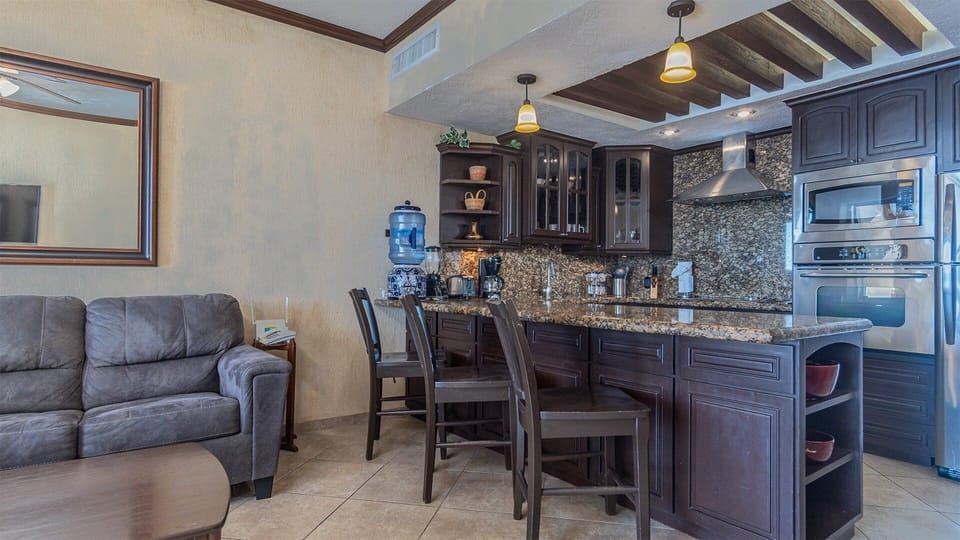 Additional seating at the kitchen counter.