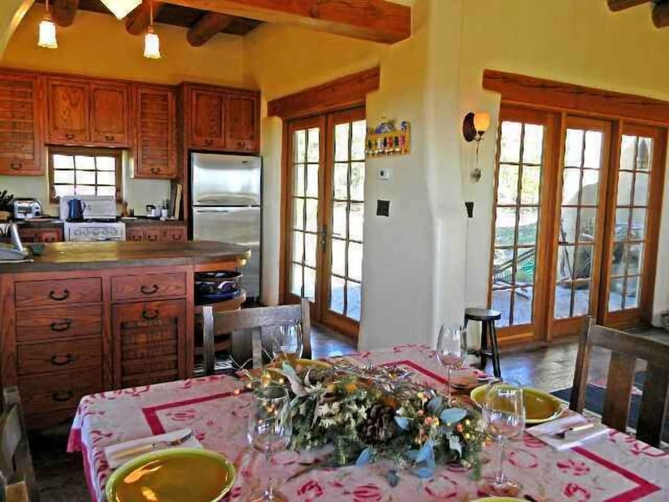 Dining view to front patio and into kitchen