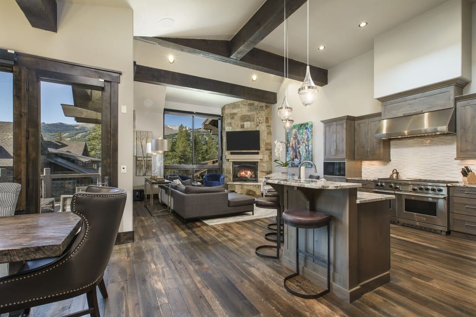 View from the main entrance into the great room with kitchen, dining, and family room.