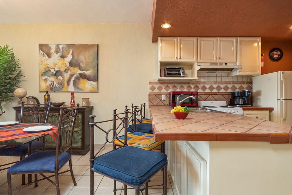 Bar stools at the kitchen counter.