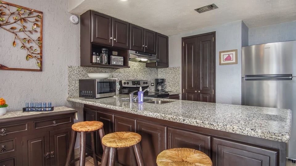 Bar stools at the kitchen counter.