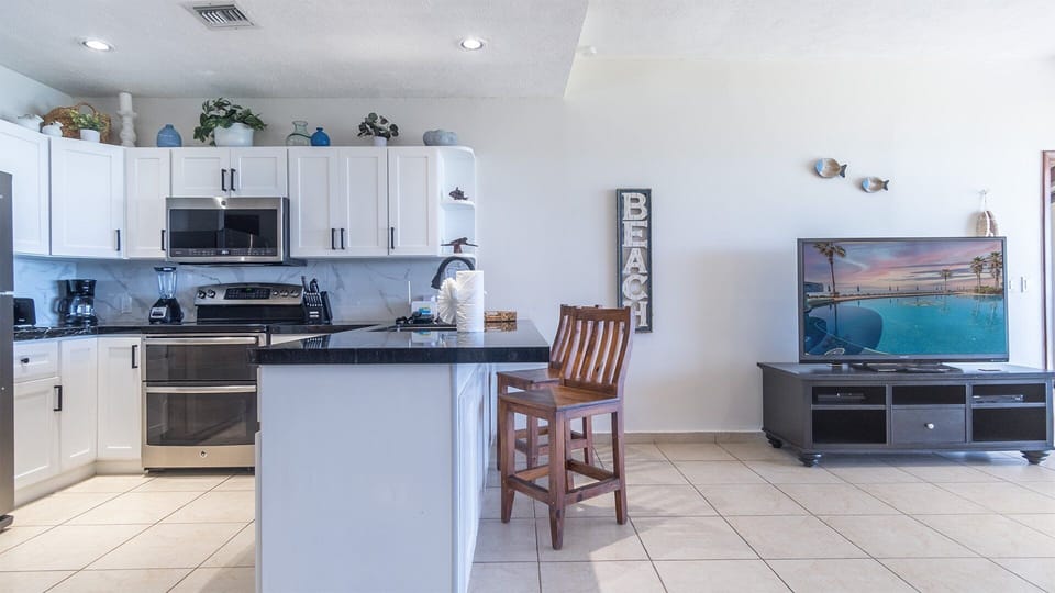 Full kitchen has all needed large appliances, small appliances, cookware, coffee maker and Keurig.