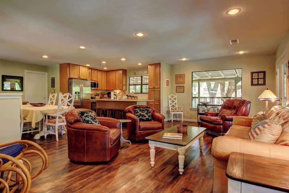 Open living room/kitchen/dining area (upstairs) with beautiful views from the full wrap around deck!