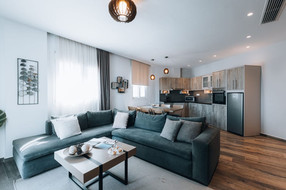 Deluxe 2-Bedroom Apartment Partial Sea View | Living area | Flat-screen TV
