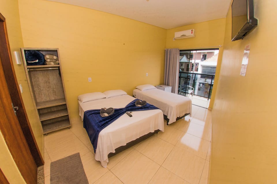 Standard Triple Room | Minibar, blackout drapes, iron/ironing board, free WiFi