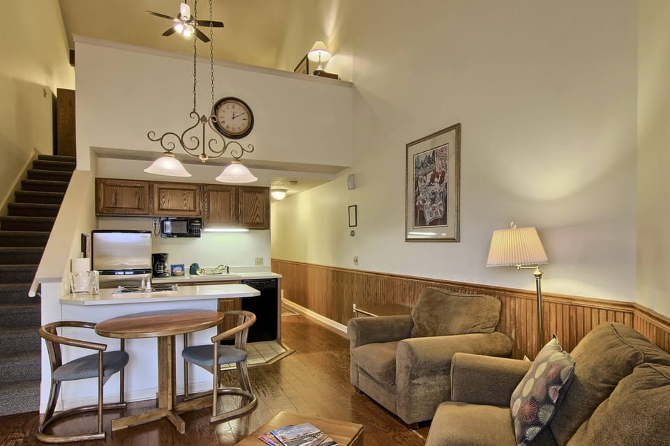 Living Room - The queen-sized sleeper sofa is in the living room along with a separate chair. Also a flat screen tv with cable & DVD player. Off the living room is the walk-out screened in patio with seating for two.