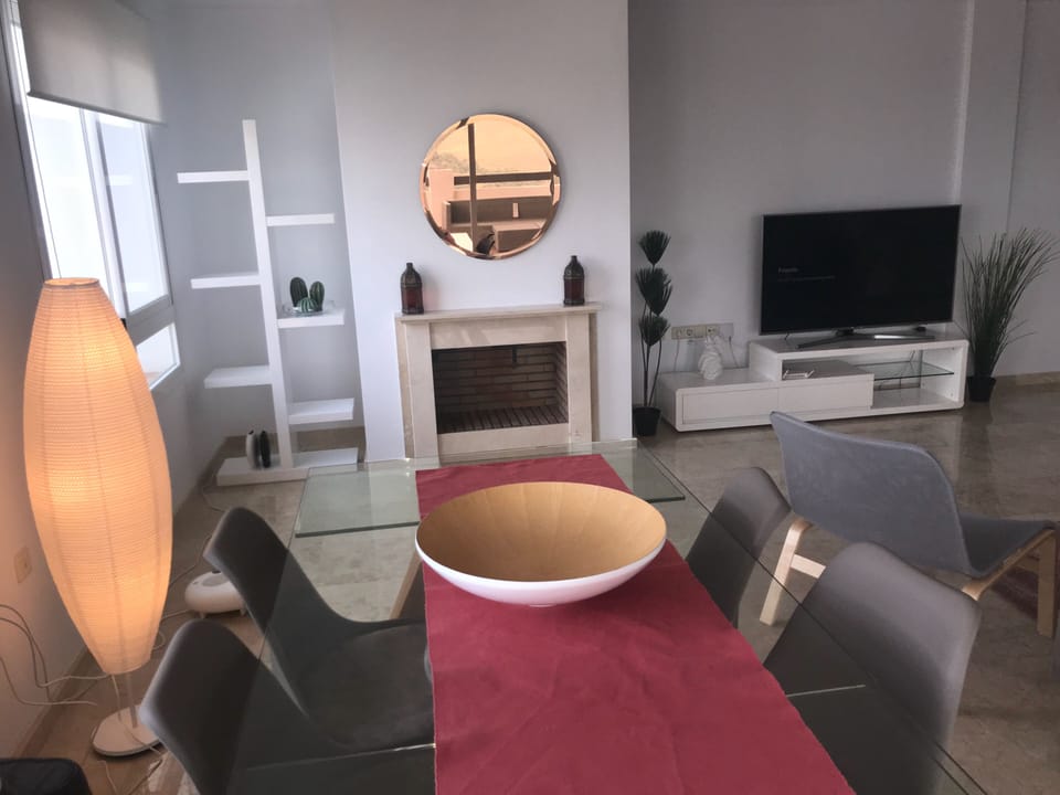 Dining area with pool and mountain views