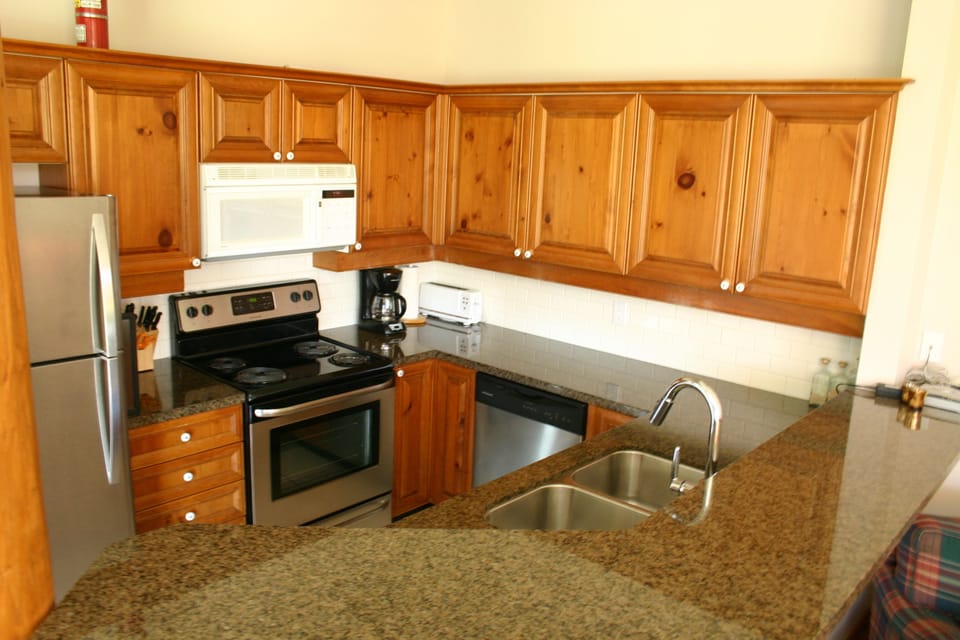Updated fully equipped kitchen with stainless steel appliances.