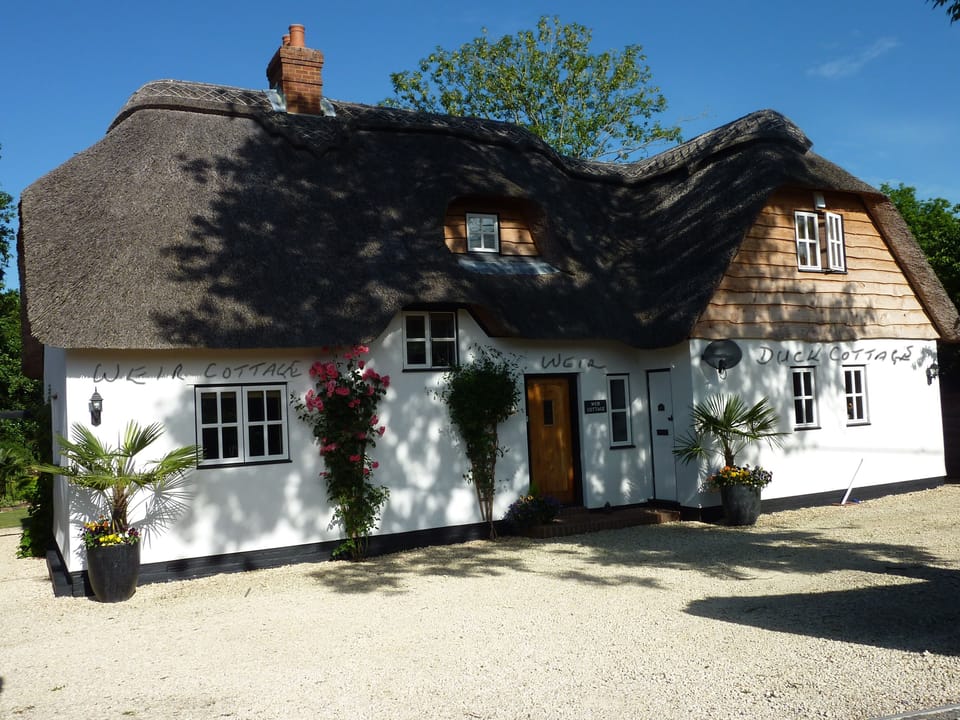 Weir Cottage on left. Duck Cottage on rightis unavailable