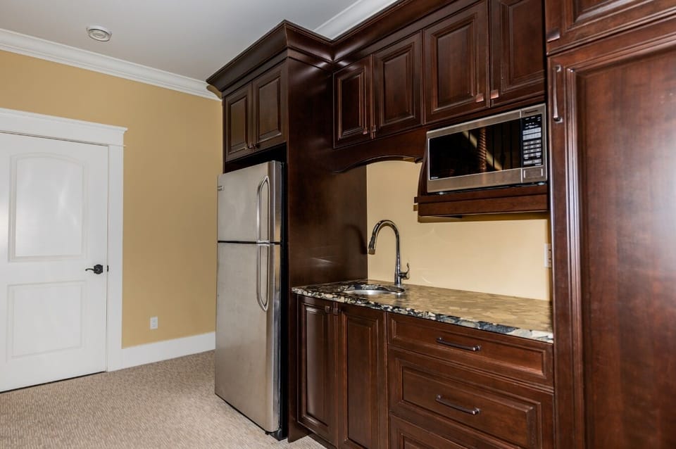 Family room kitchenette, full sized fridge, microwave, sink