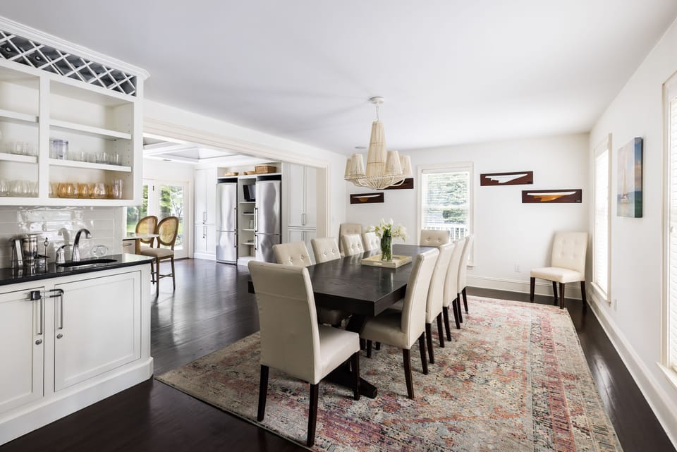 Dining room comfortably seats 14 w/settings for all & open floor plan to kitchen