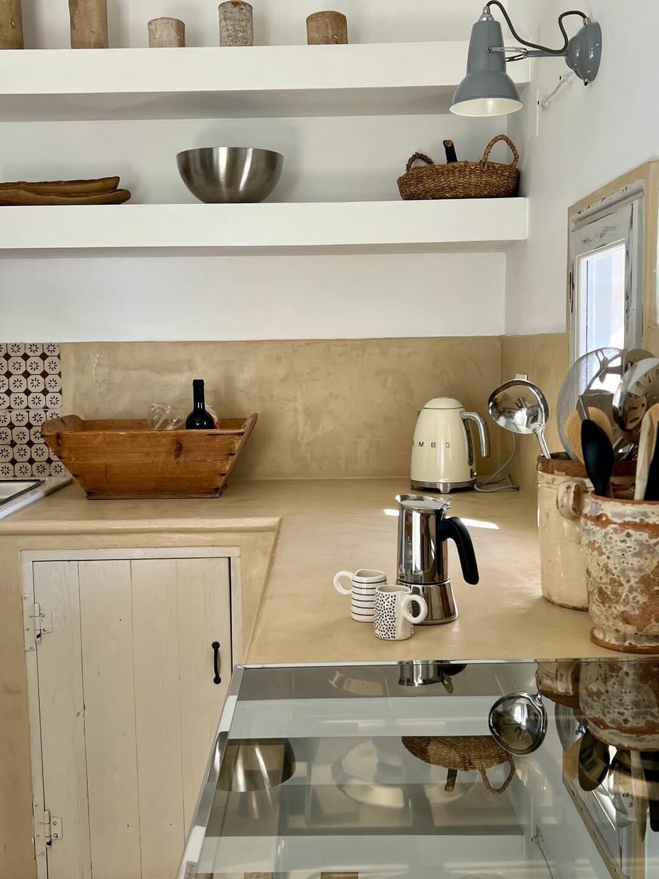Microcement worktops create a mediterranean feel to this kitchen