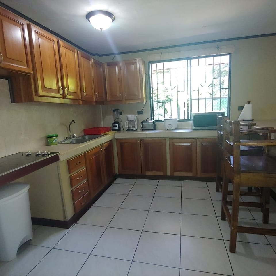 Modern spacious kitchen with all the utensils needed.