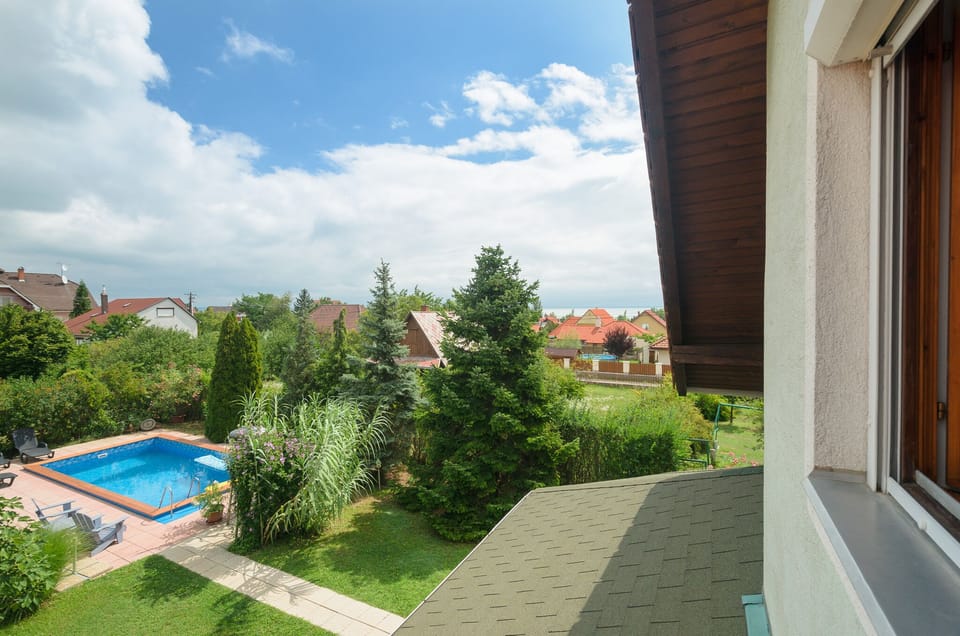 Pool and lake view from bedroom window