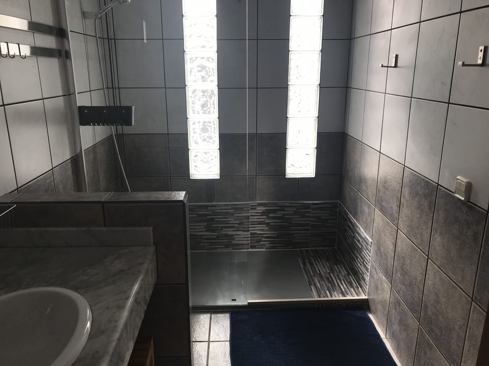 En suite bathroom with walk in shower
