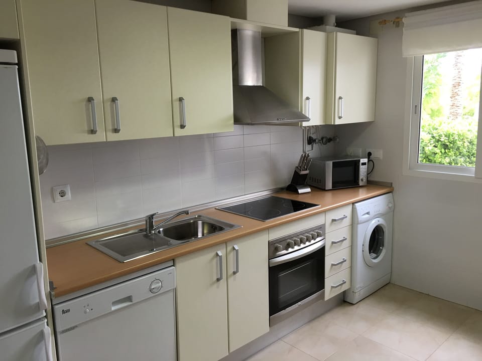 Large kitchen with all amenities including washing machine