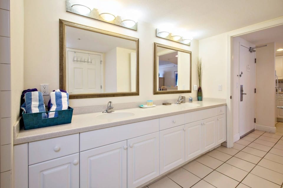 This large bathroom with two sinks is accommodating for a couple or family.