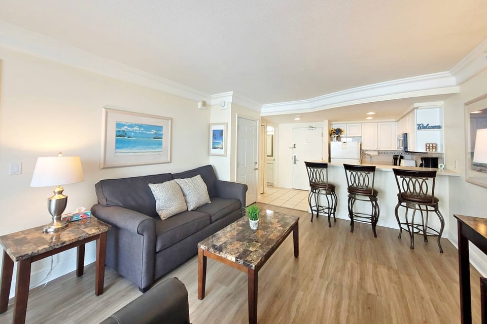 Spacious living area with sleeper sofa and sleeper love seat.