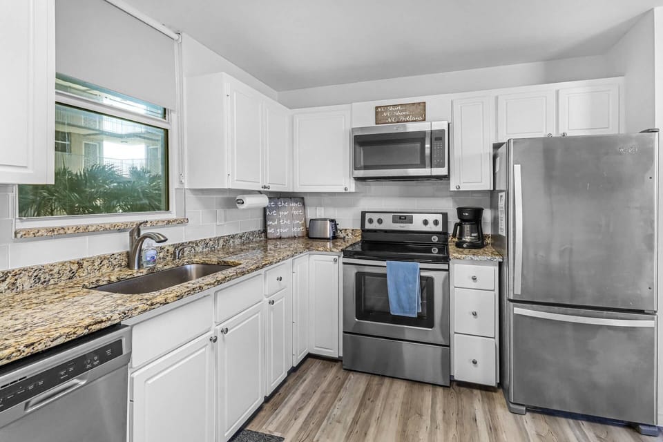 Updated and modern; full sized stainless steel appliances, granite countertops, and tiled backsplash.