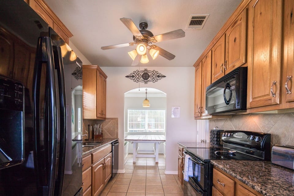 Galley-style kitchen + dining area