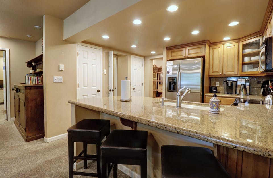 Bar stool seating in kitchen.