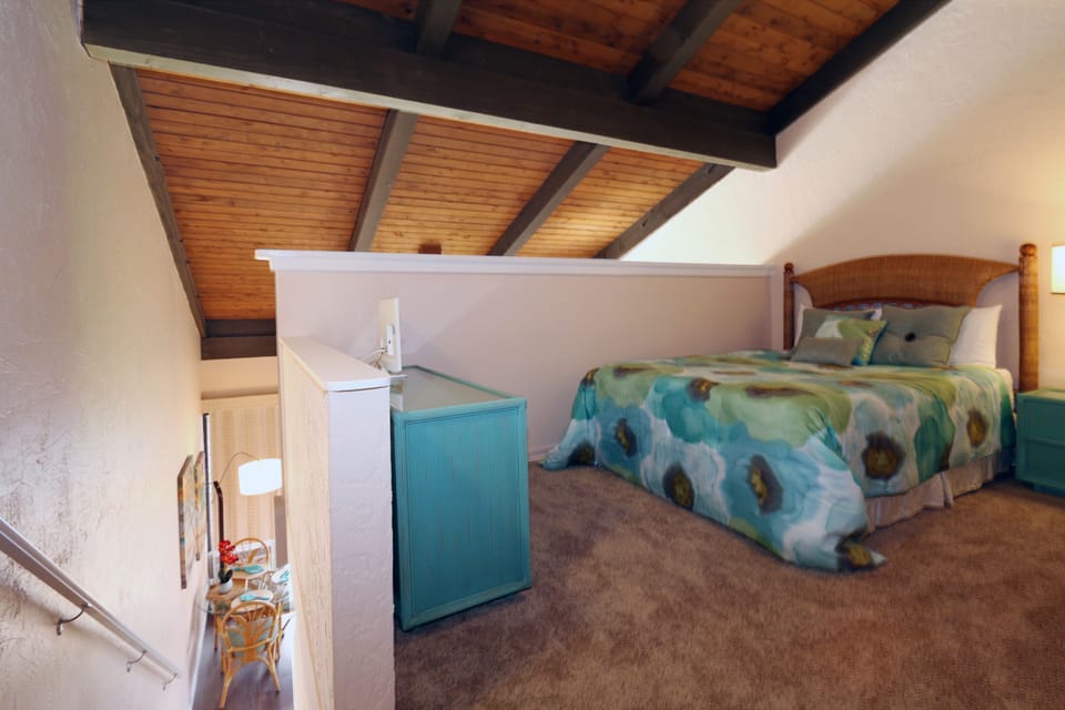 Loft bedroom with small dresser