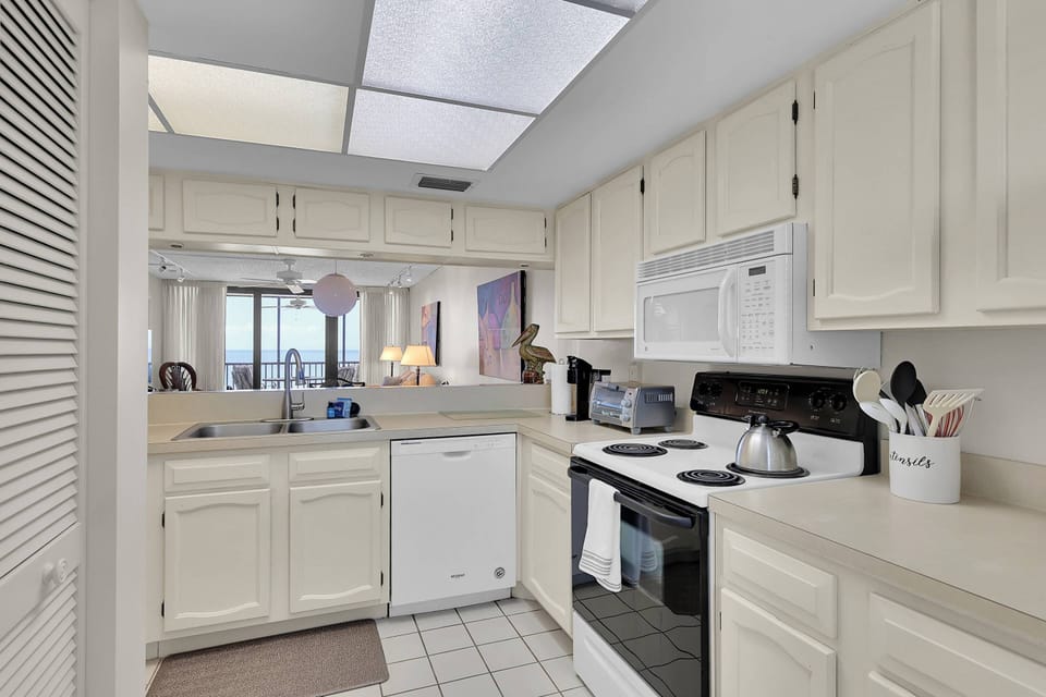 Open, pass through kitchen allows for full interaction, even while preparing meals.