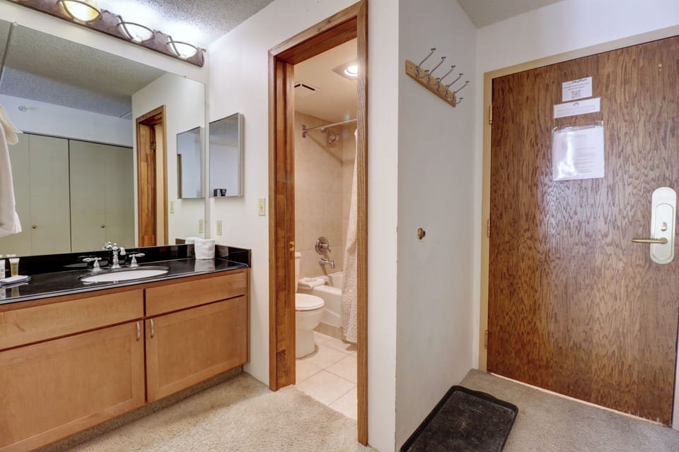 Entryway and bathroom area.