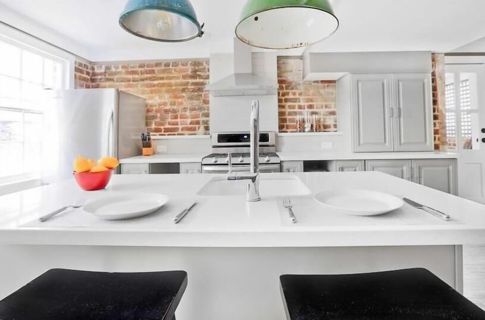 The kitchen offers a large breakfast bar, with seating for two.