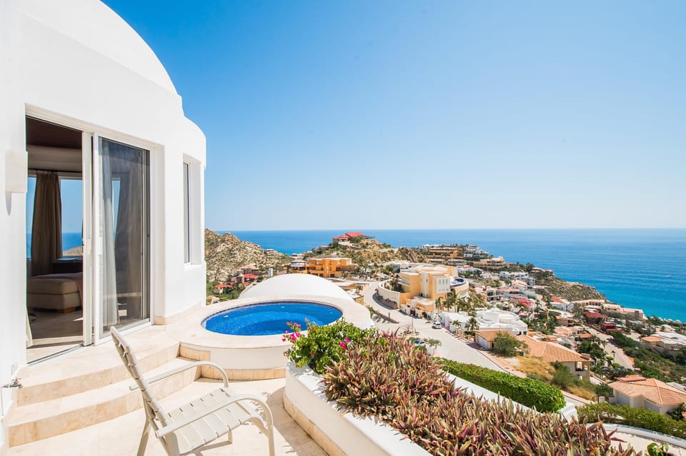 Outdoor patio with infinity pool and ocean view