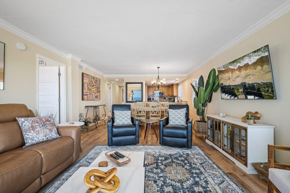 The gorgeous, professionally decorated oceanfront living room at Shorehom by the Sea 50 offers a stylish and comfortable space to unwind