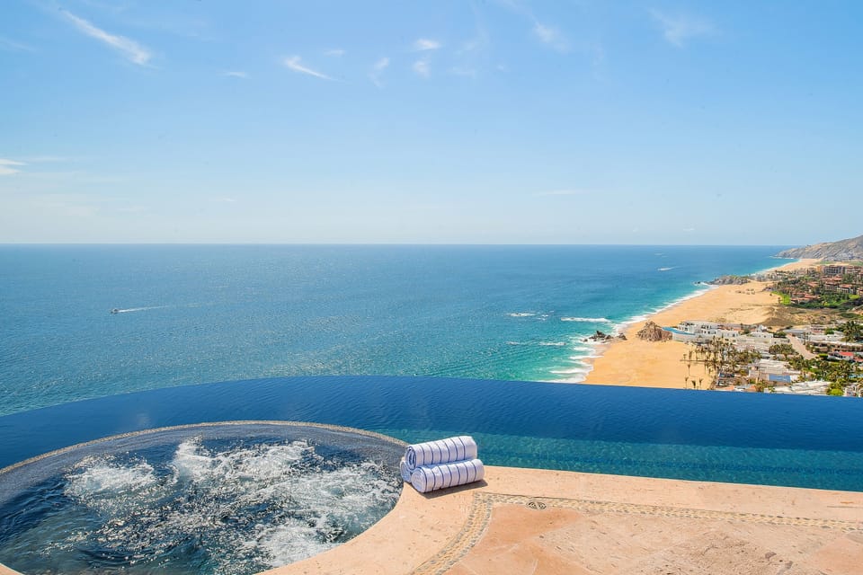 Jacuzzi and infinity pool overlooking beachfront views